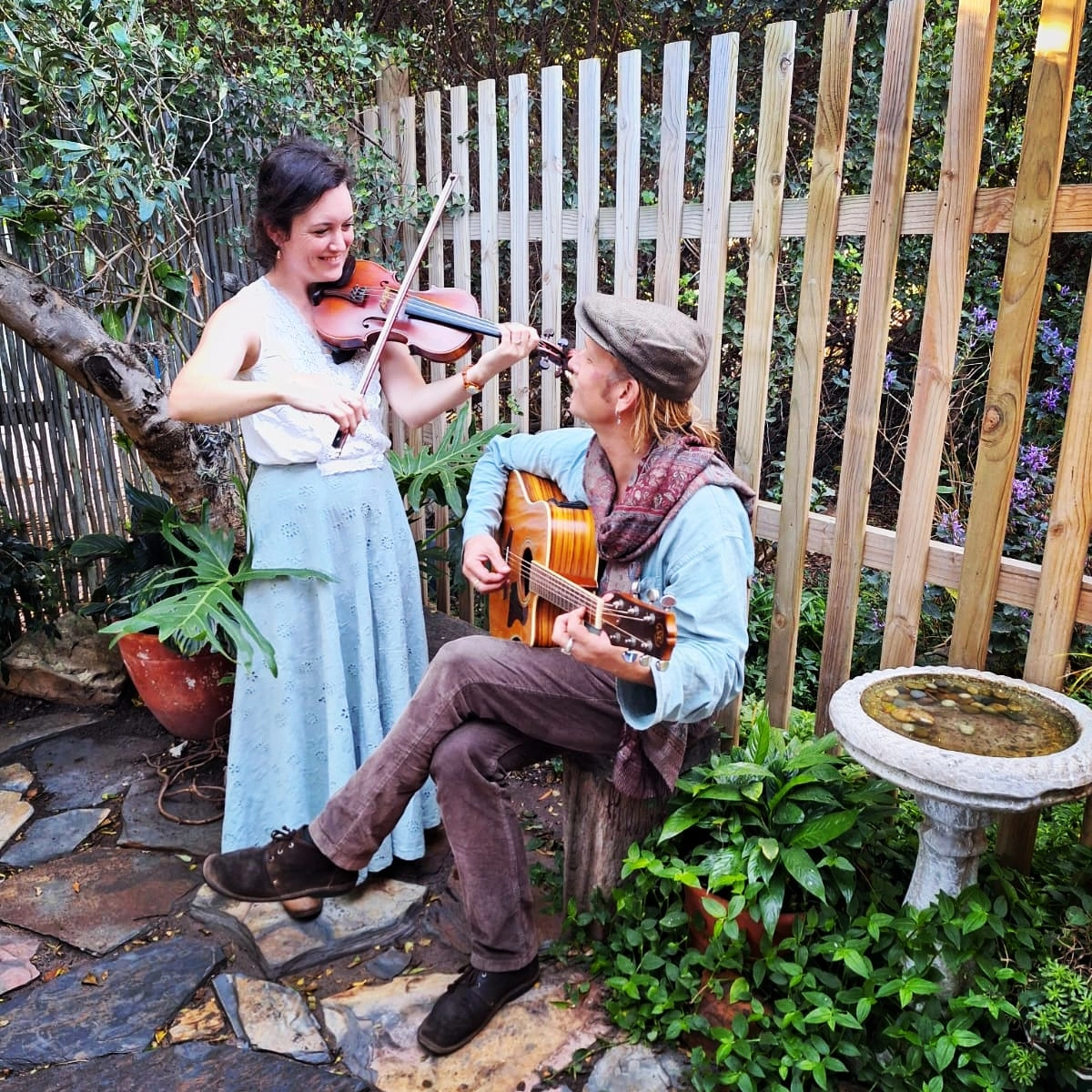 Fairfolk Duo playing a small wedding in a garden
